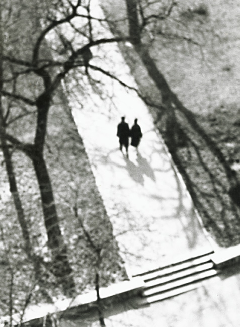 Vilem Reichman - Couple Walking on Walkway Vilem Reichman - Couple Walking on Walkway