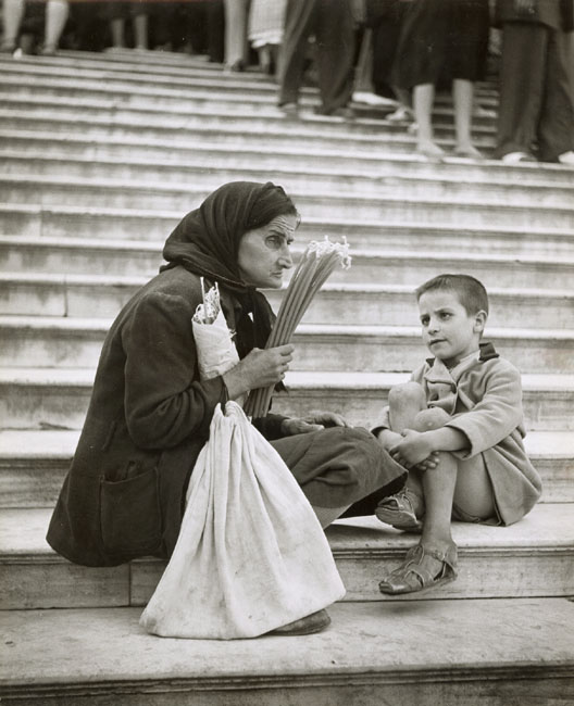 Ernst Haas - Old Woman with Candles and Child on Stairs Ernst Haas - Old Woman with Candles and Child on Stairs