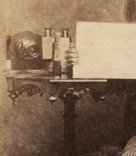 Young Graduate with Rare Lens, Stereo Viewer, Sign and a Cat in His Lap