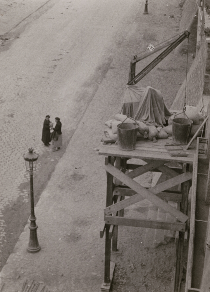 André Kertész - Dimanche (Sunday), Paris (Two Women Under Scaffold)