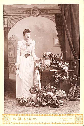 Woman with Bouquets of Flowers and Photo Album