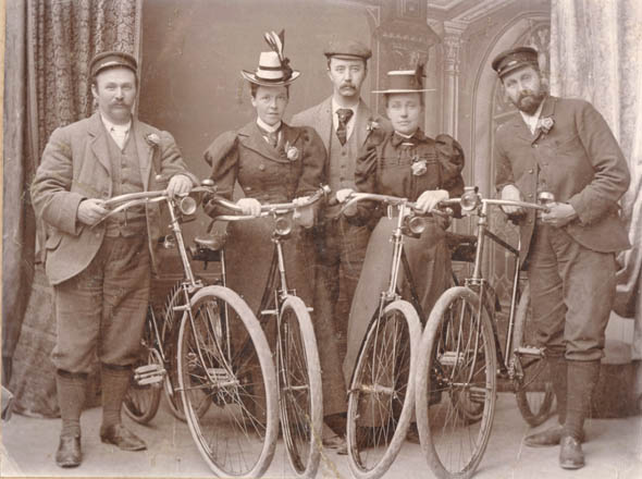 Anonymous - Studio Portrait of Men and Women with Their Bicycles Anonymous - Studio Portrait of Men and Women with Their Bicycles