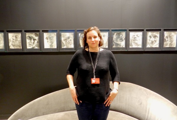 Ina Schmidt-Runke in front of the Kicken booth's Helmer Lerski series "Metamorphosis through Light"